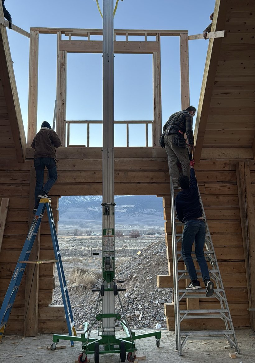 Family on ladders and a lift building our biggest dormer, the valley beyond